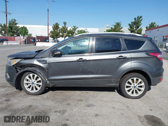2018 Ford Escape Titanium with VIN 1FMCU0J98JUA03474, listed as a IAAI auction lot 37677880 with 106,423 mi miles and . Bid and sale history available at DreamBid. Image 14.