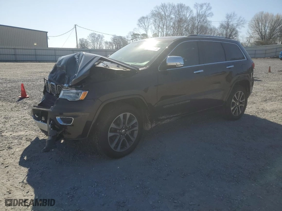 2017 Jeep Grand Cherokee Overland with VIN 1C4RJECG2HC712823, listed as a Copart auction lot 48063325 with 124,812 mi miles and Salvage Title. Bid and sale history available at carsss.com. Image 1.