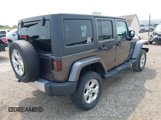 2014 Jeep Wrangler Unlimited Sahara with VIN 1C4BJWEG8EL285843, listed as a IAAI auction lot 42399090 with Not provided miles and . Bid and sale history available at DreamBid. Image 4.