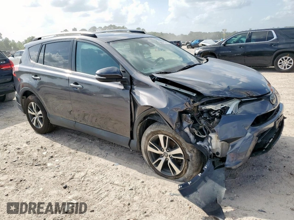2018 Toyota RAV4 XLE with VIN 2T3WFREV2JW409292, listed as a Copart auction lot 61577355 with 189,258 mi miles and Salvage title. Bid and sale history available at DreamBid. Image 4.