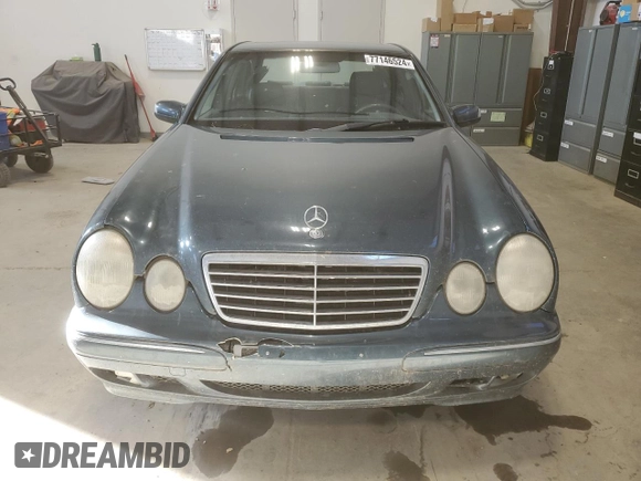 2000 Mercedes-Benz E-Class AWD with VIN WDBJF82G4YX027683, listed as a Copart auction lot 77146524 with 228,654 mi miles and Clean Title. Bid and sale history available at carsss.com. Image 5.