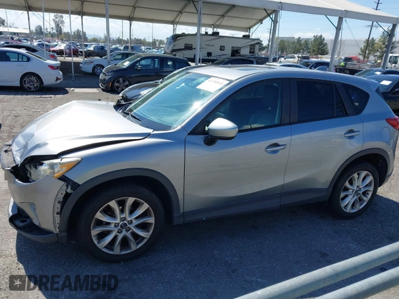 2014 Mazda CX-5 Grand Touring with VIN JM3KE2DY0E0331942, listed as a IAAI auction lot 41750533 with 163,387 mi miles. Bid and sale history available at carsss.com. Image 14.