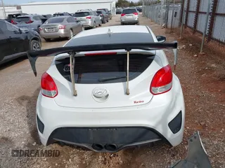 2013 Hyundai Veloster Turbo z VIN KMHTC6AE2DU128607, wystawiony jako IAAI lot #41788836 z przebiegiem 115 500 mil mil oraz . Historia ofert i sprzedaży dostępna na DreamBid. Obrazek 17.