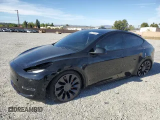 2022 Tesla Model Y Performance z VIN 7SAYGDEF8NF521756, wystawiony jako Copart lot #53754605 z przebiegiem 25 398 mil mil oraz Szkoda całkowita • Salvage title. Historia ofert i sprzedaży dostępna na DreamBid. Obrazek 1.