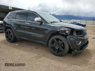 2014 Jeep Grand Cherokee Limited z VIN 1C4RJFBT6EC184557, wystawiony jako Copart lot #57657095 z przebiegiem 157 688 mil mil oraz Szkoda całkowita • Salvage title. Historia ofert i sprzedaży dostępna na DreamBid. Obrazek 4.