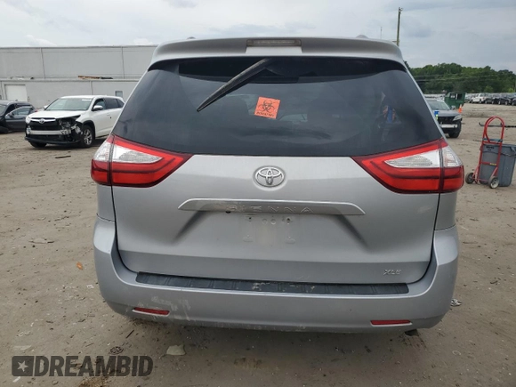 2015 Toyota Sienna XLE с VIN 5TDYK3DC1FS541180, выставлен на аукционе Copart как лот 59078585 с пробегом 94 014 миль миль и Списание • Salvage title. История ставок и продаж доступна на DreamBid. Изображение 6.