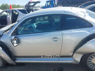 2014 Volkswagen Beetle 2.5L w/Sun with VIN 3VWJP7AT7EM633386, listed as a IAAI auction lot 42060290 with 273,374 mi miles and . Bid and sale history available at DreamBid. Image 15.