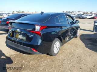 2021 Toyota Prius L Eco with VIN JTDKAMFU1M3134107, listed as a IAAI auction lot 41763080 with 185,248 mi miles. Bid and sale history available at carsss.com. Image 4.