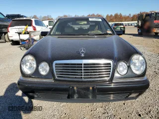 1997 Mercedes-Benz E-Class with VIN WDBJF72F0VA523161, listed as a Copart auction lot 77752804 with 143,495 mi miles and Salvage Title. Bid and sale history available at carsss.com. Image 5.