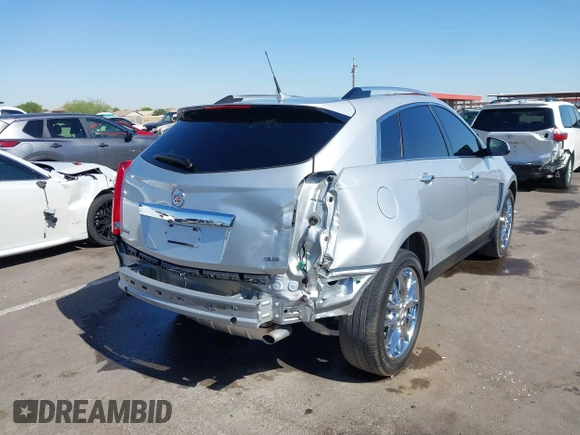 2013 Cadillac SRX Premium Collection z VIN 3GYFNEE36DS556446, wystawiony jako IAAI lot #42289824 z przebiegiem 23 988 mil mil oraz . Historia ofert i sprzedaży dostępna na DreamBid. Obrazek 6.