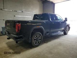2020 GMC Sierra 2500HD AT4 z VIN 1GT49PEY7LF135671, wystawiony jako Copart lot #55740405 z przebiegiem 80 382 mil mil oraz Szkody całkowita. Historia ofert i sprzedaży dostępna na DreamBid. Obrazek 3.