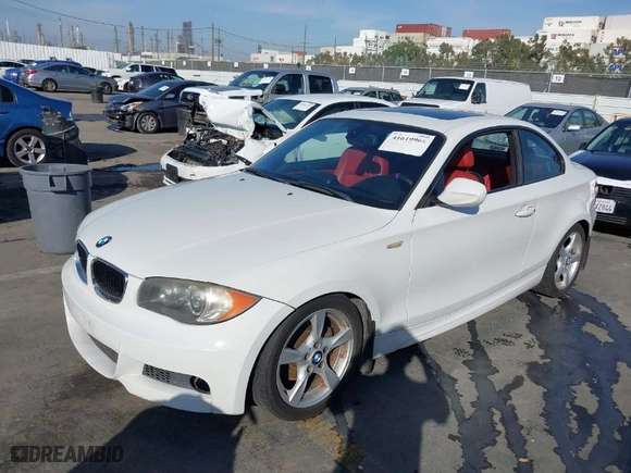 2011 BMW 1 Series 128i with VIN WBAUP9C53BVL89535, listed as a IAAI auction lot 41619966 with 184,610 mi miles. Bid and sale history available at carsss.com. Image 2.