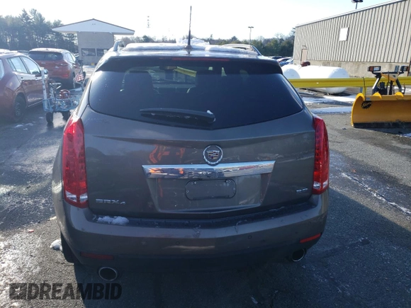 2014 Cadillac SRX Premium Collection z VIN 3GYFNGE37ES566089, wystawiony jako Copart lot #83595454 z przebiegiem 209 155 mil mil oraz Szkody całkowita. Historia ofert i sprzedaży dostępna na DreamBid. Obrazek 6.
