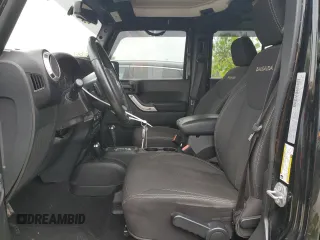2017 Jeep Wrangler Unlimited Sahara with VIN 1C4BJWEGXHL594203, listed as a Copart auction lot 57359515 with 101,763 mi miles and Salvage title. Bid and sale history available at DreamBid. Image 7.