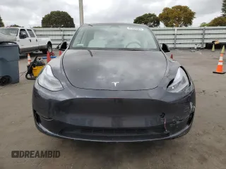 2025 Tesla Model Y Long Range with VIN 7SAYGDED6SF228626, listed as a Copart auction lot 47654525 with 2,087 mi miles and Salvage Title. Bid and sale history available at DreamBid. Image 5.