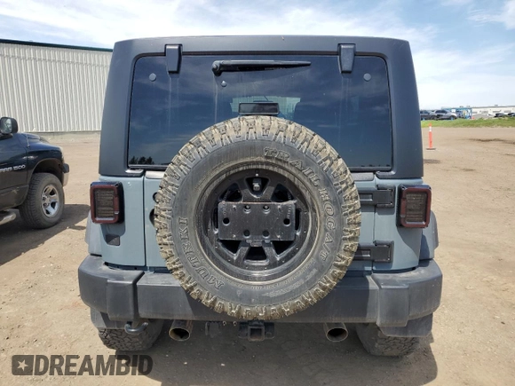 2014 Jeep Wrangler Unlimited Sahara with VIN 1C4BJWEG7EL228307, listed as a Copart auction lot 58663455 with 188,024 mi miles and Salvage title. Bid and sale history available at DreamBid. Image 6.