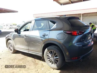2021 Mazda CX-5 Touring with VIN JM3KFACM2M1313750, listed as a IAAI auction lot 41762938 with 68,503 mi miles. Bid and sale history available at carsss.com. Image 3.