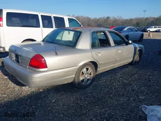 2005 Ford Crown Victoria LX with VIN 2FAFP74W95X166416, listed as a IAAI auction lot 41526872 with 195,589 mi miles. Bid and sale history available at carsss.com. Image 4.