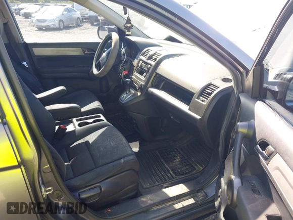 2010 Honda CR-V LX with VIN JHLRE4H33AC002519, listed as a IAAI auction lot 42577053 with 290,435 mi miles and . Bid and sale history available at DreamBid. Image 5.