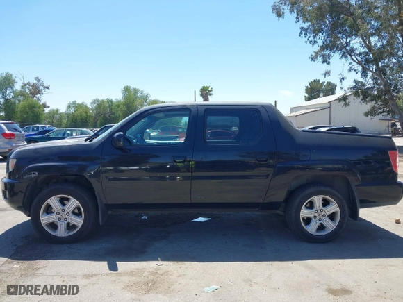 2011 Honda Ridgeline RTL with VIN 5FPYK1F50BB001442, listed as a IAAI auction lot 42023615 with 189,170 mi miles. Bid and sale history available at carsss.com. Image 14.