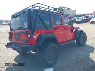 2016 Jeep Wrangler Unlimited Rubicon with VIN 1C4HJWFG7GL128994, listed as a IAAI auction lot 40503403 with 85,950 mi miles. Bid and sale history available at carsss.com. Image 4.