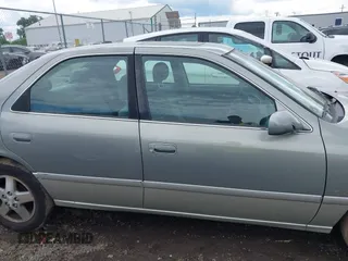 2001 Toyota Camry CE z VIN JT2BG22K410587070, wystawiony jako IAAI lot #42388043 z przebiegiem 119 183 mil mil oraz . Historia ofert i sprzedaży dostępna na DreamBid. Obrazek 14.