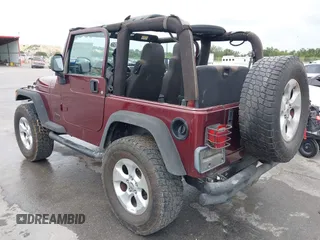 2003 Jeep Wrangler Sport with VIN 1J4FA49S63P324904, listed as a IAAI auction lot 42138001 with 170,917 mi miles and . Bid and sale history available at DreamBid. Image 3.