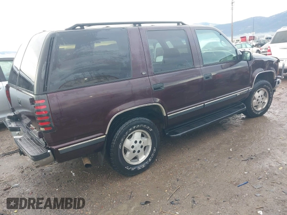 1997 GMC Yukon with VIN 1GKEK13R0VJ755574, listed as a IAAI auction lot 41158932 with 212,668 mi miles. Bid and sale history available at carsss.com. Image 4.