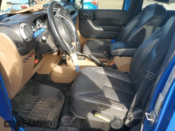2015 Jeep Wrangler Unlimited Altitude with VIN 1C4BJWEG1FL514848, listed as a Copart auction lot 86474114 with 84,349 mi miles and Salvage title. Bid and sale history available at DreamBid. Image 7.