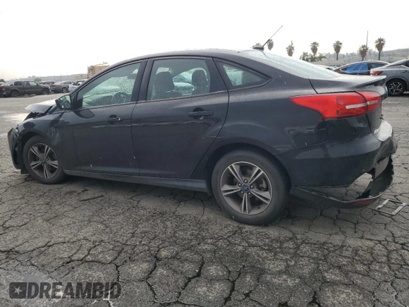 2018 Ford Focus SE with VIN 1FADP3FE8JL300246, listed as a Copart auction lot 59585035 with 83,141 mi miles and Salvage title. Bid and sale history available at DreamBid. Image 2.