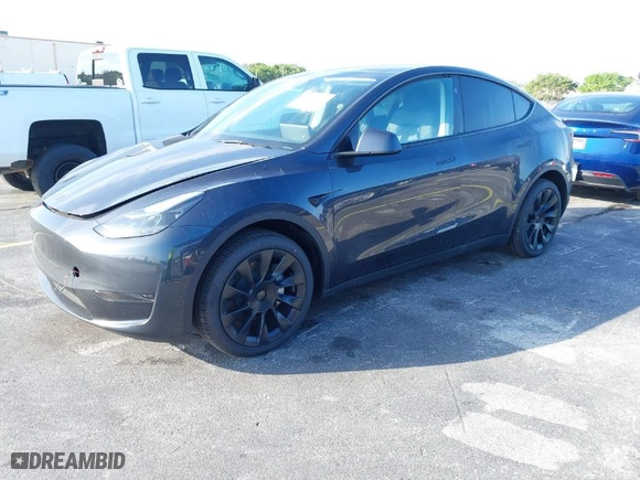 2024 Tesla Model Y with VIN 7SAYGDED4RF097142, listed as a IAAI auction lot 41484729 with 20 mi miles. Bid and sale history available at carsss.com. Image 2.