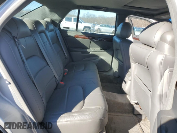 2002 Cadillac DeVille DTS with VIN 1G6KF57922U124813, listed as a Copart auction lot 87055984 with 94,769 mi miles and Salvage Title. Bid and sale history available at carsss.com. Image 10.