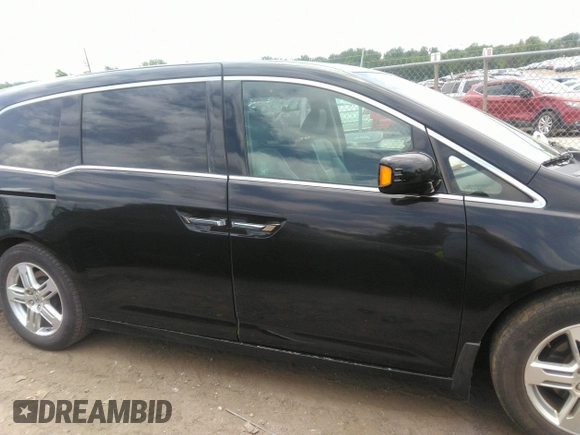 2012 Honda Odyssey Touring with VIN 5FNRL5H97CB066596, listed as a IAAI auction lot 42472935 with 217,182 mi miles and . Bid and sale history available at DreamBid. Image 13.