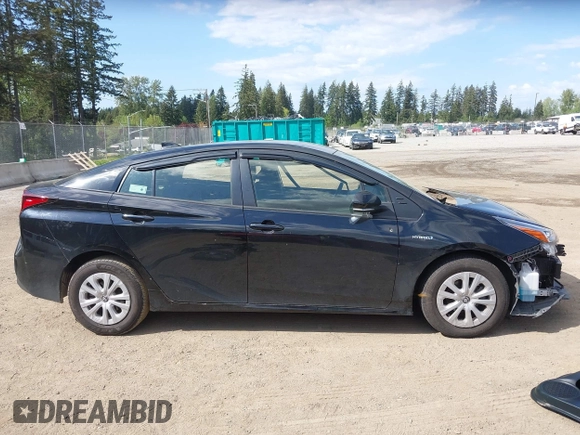 2021 Toyota Prius L Eco with VIN JTDKAMFU3M3140233, listed as a IAAI auction lot 42182685 with 38,842 mi miles and . Bid and sale history available at DreamBid. Image 14.