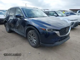2023 Mazda CX-5 S Carbon Edition z VIN JM3KFBCM4P0288155, wystawiony jako IAAI lot #41501030 z przebiegiem 26 516 mil mil oraz . Historia ofert i sprzedaży dostępna na DreamBid. Obrazek 1.