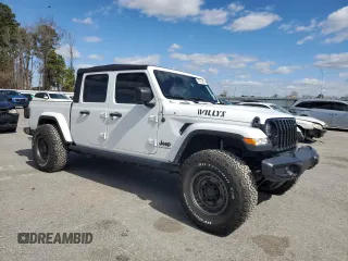 2023 Jeep Gladiator Sport S with VIN 1C6HJTAG4PL556387, listed as a Copart auction lot 47453305 with 35,611 mi miles and Salvage title. Bid and sale history available at DreamBid. Image 4.