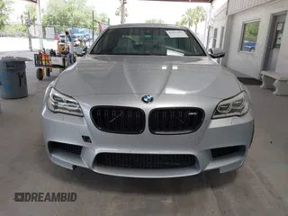 2014 BMW M5 z VIN WBSFV9C57ED097794, wystawiony jako IAAI lot #42257563 z przebiegiem 120 933 mil mil oraz . Historia ofert i sprzedaży dostępna na DreamBid. Obrazek 12.