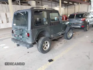 2000 Jeep Wrangler Sport with VIN 1J4FA49S8YP780104, listed as a IAAI auction lot 42095731 with Not provided miles and . Bid and sale history available at DreamBid. Image 4.