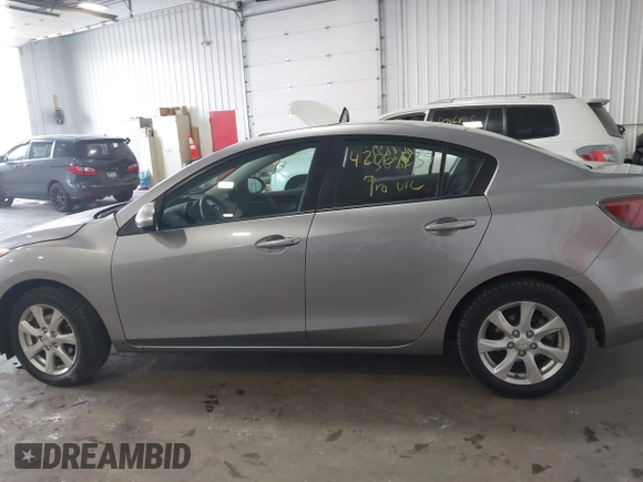 2011 Mazda Mazda3 i Touring with VIN JM1BL1VFXB1900999, listed as a IAAI auction lot 42067239 with 202,829 mi miles. Bid and sale history available at carsss.com. Image 14.