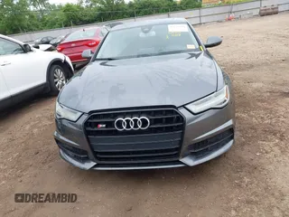 2016 Audi S6 Prestige z VIN WAUH2AFC1GN016187, wystawiony jako IAAI lot #42274744 z przebiegiem 169 821 mil mil oraz . Historia ofert i sprzedaży dostępna na DreamBid. Obrazek 12.