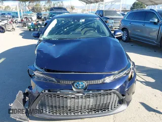 2021 Toyota Corolla Hybrid LE with VIN JTDEAMDEXMJ018828, listed as a IAAI auction lot 41633192 with 63,302 mi miles. Bid and sale history available at carsss.com. Image 13.