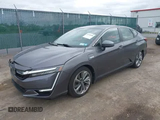 2018 Honda Clarity Touring z VIN JHMZC5F3XJC001054, wystawiony jako IAAI lot #42292688 z przebiegiem 60 780 mil mil oraz . Historia ofert i sprzedaży dostępna na DreamBid. Obrazek 17.