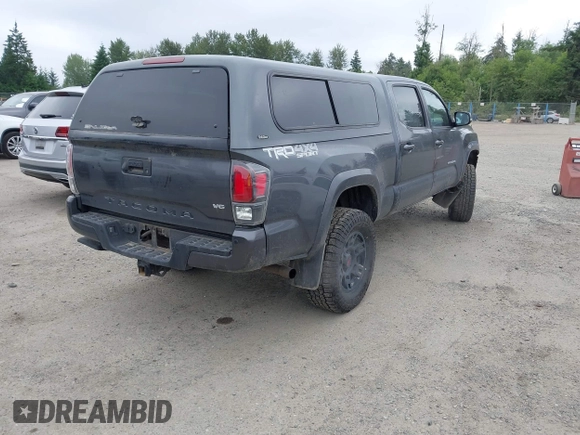 2021 Toyota Tacoma SR5 with VIN 3TMDZ5BN1MM119711, listed as a IAAI auction lot 42479038 with 64,779 mi miles and . Bid and sale history available at DreamBid. Image 4.