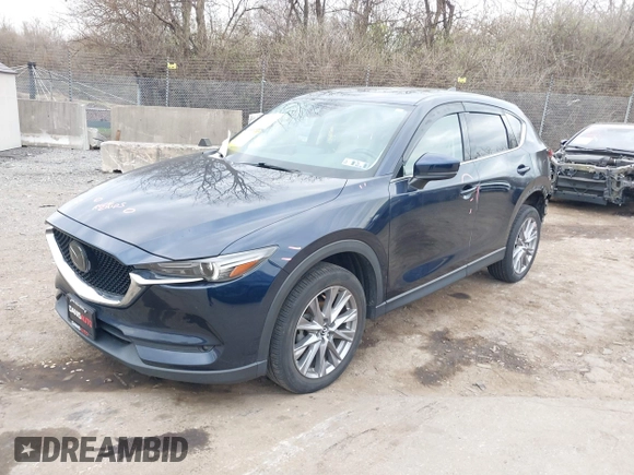 2021 Mazda CX-5 Grand Touring with VIN JM3KFADM0M1321375, listed as a IAAI auction lot 41913449 with 88,178 mi miles. Bid and sale history available at carsss.com. Image 18.