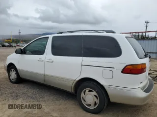 1999 Toyota Sienna LE with VIN 4T3ZF13C4XU134680, listed as a Copart auction lot 74044544 with 127,954 mi miles and Clean Title. Bid and sale history available at carsss.com. Image 2.