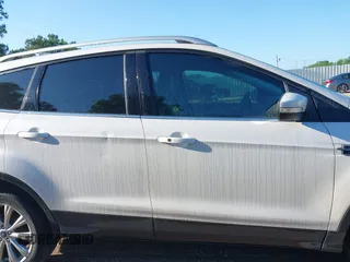 2017 Ford Escape Titanium with VIN 1FMCU0J90HUC51244, listed as a IAAI auction lot 42206165 with 106,847 mi miles and . Bid and sale history available at DreamBid. Image 13.