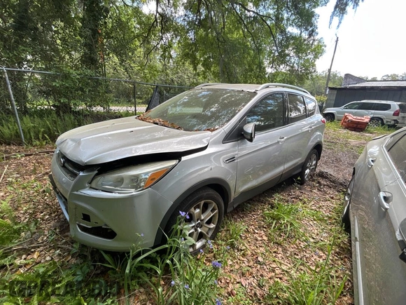 2016 Ford Escape Titanium with VIN 1FMCU9JXXGUC33190, listed as a Copart auction lot 51374865 with 222,129 mi miles and Clean Title. Bid and sale history available at carsss.com. Image 2.