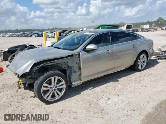 2013 Jaguar XJ Portfolio with VIN SAJWJ2GD5D8V49505, listed as a Copart auction lot 61171955 with 129,158 mi miles and Salvage title. Bid and sale history available at DreamBid. Image 1.