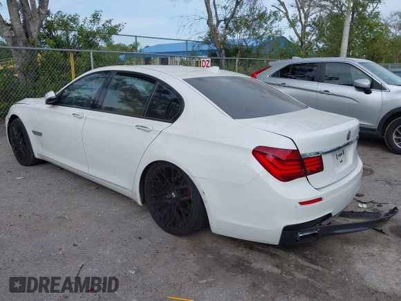 2013 BMW 7 Series 740i with VIN WBAYA6C52DD143862, listed as a IAAI auction lot 41859183 with 133,666 mi miles. Bid and sale history available at carsss.com. Image 3.