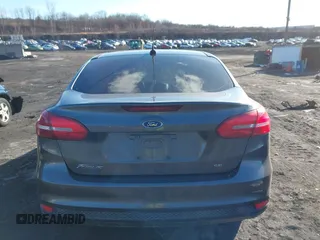 2018 Ford Focus SE z VIN 1FADP3F2XJL295508, wystawiony jako IAAI lot #41608216 z przebiegiem 89 696 mil mil oraz . Historia ofert i sprzedaży dostępna na DreamBid. Obrazek 16.